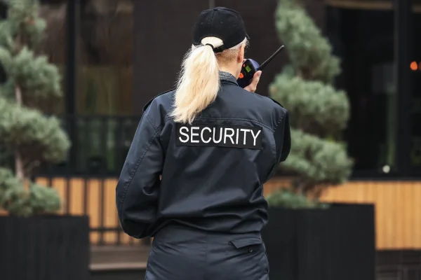 Professional unarmed security guard monitoring an Arizona property